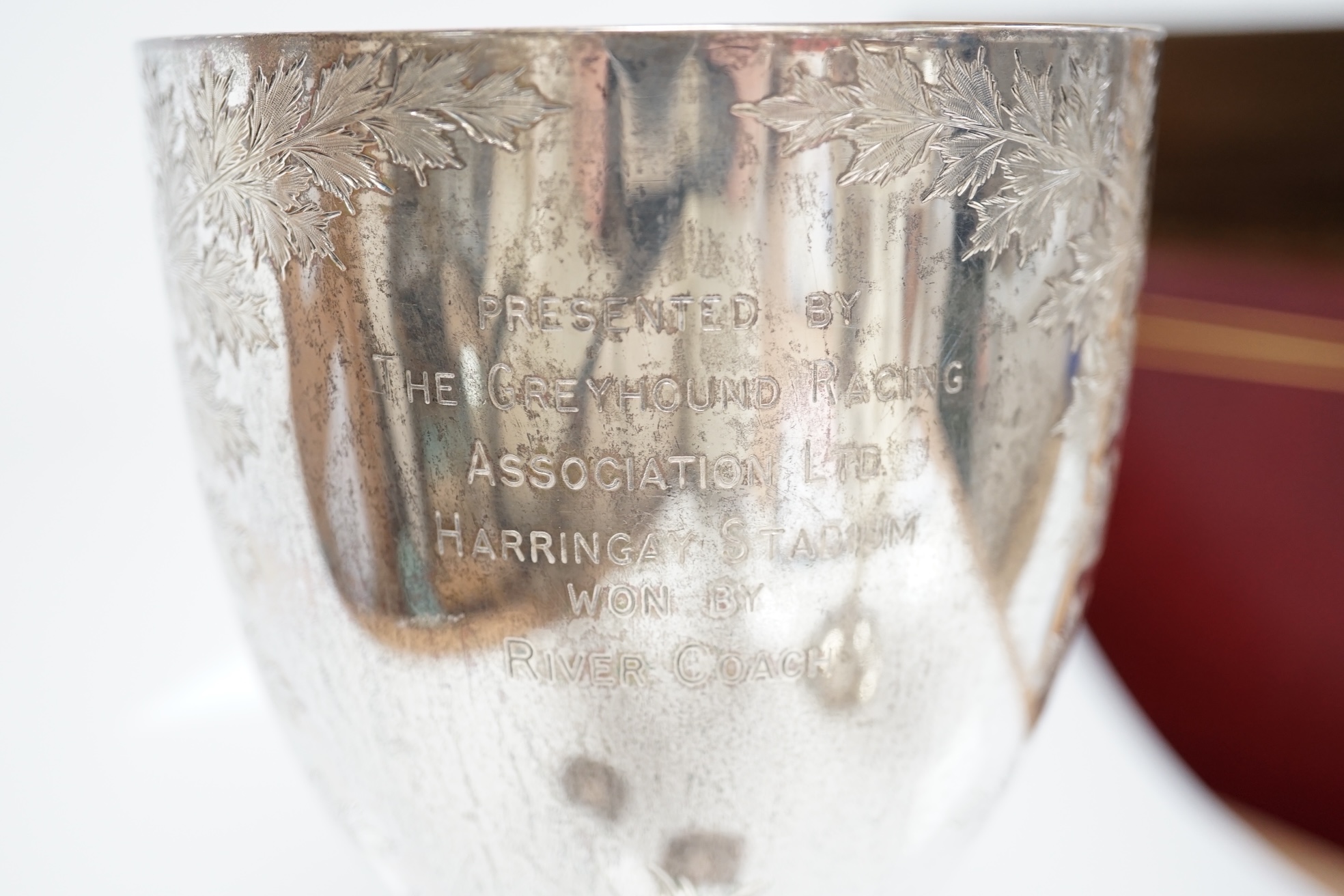 A Victorian engraved silver goblet, by Robert Harper, London 1871, with later engraved Greyhound Racing Association Ltd presentation inscription, 23.1cm, one other damaged silver trophy cup and two modern silver wine lab